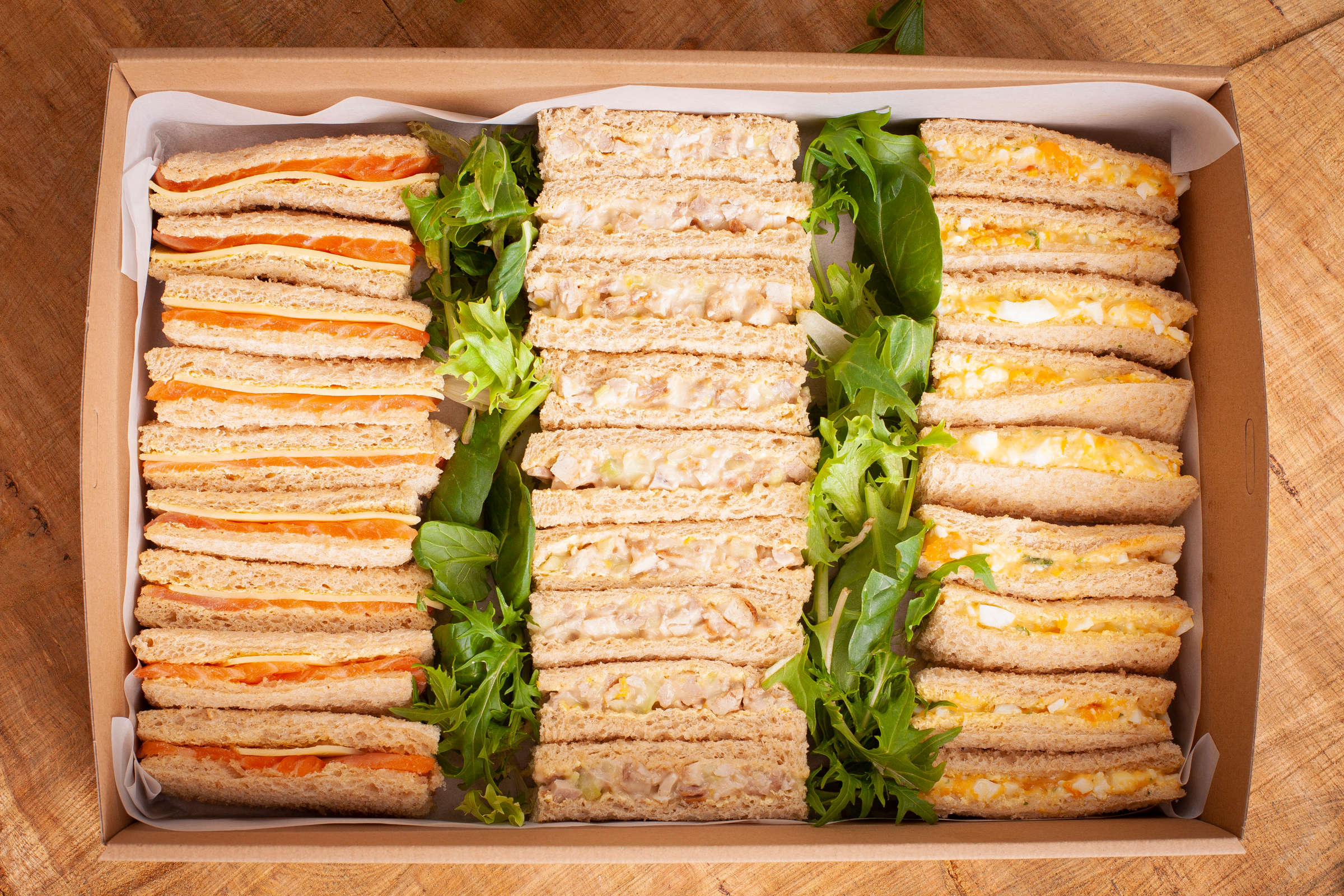 Ribbon sandwich catering box containing 30 ribbons, fillings include egg, free range chicken, smoked salmon. Credit: Richard Jupe.