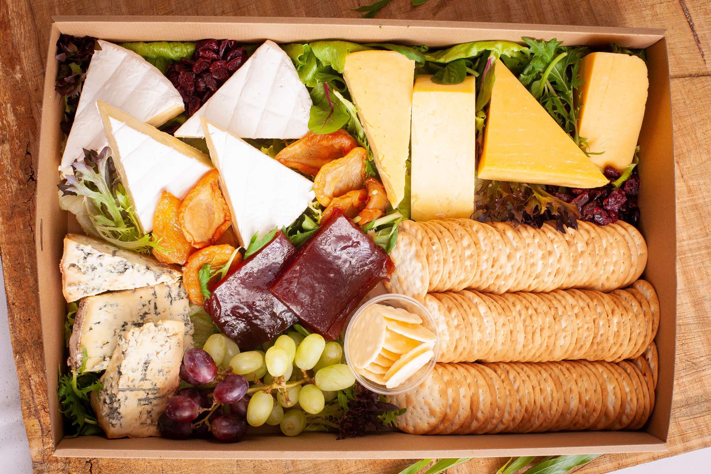 Tasmanian cheese box including brie, Blue and Cheddar with quince paste and crackers. Credit: Richard Jupe.