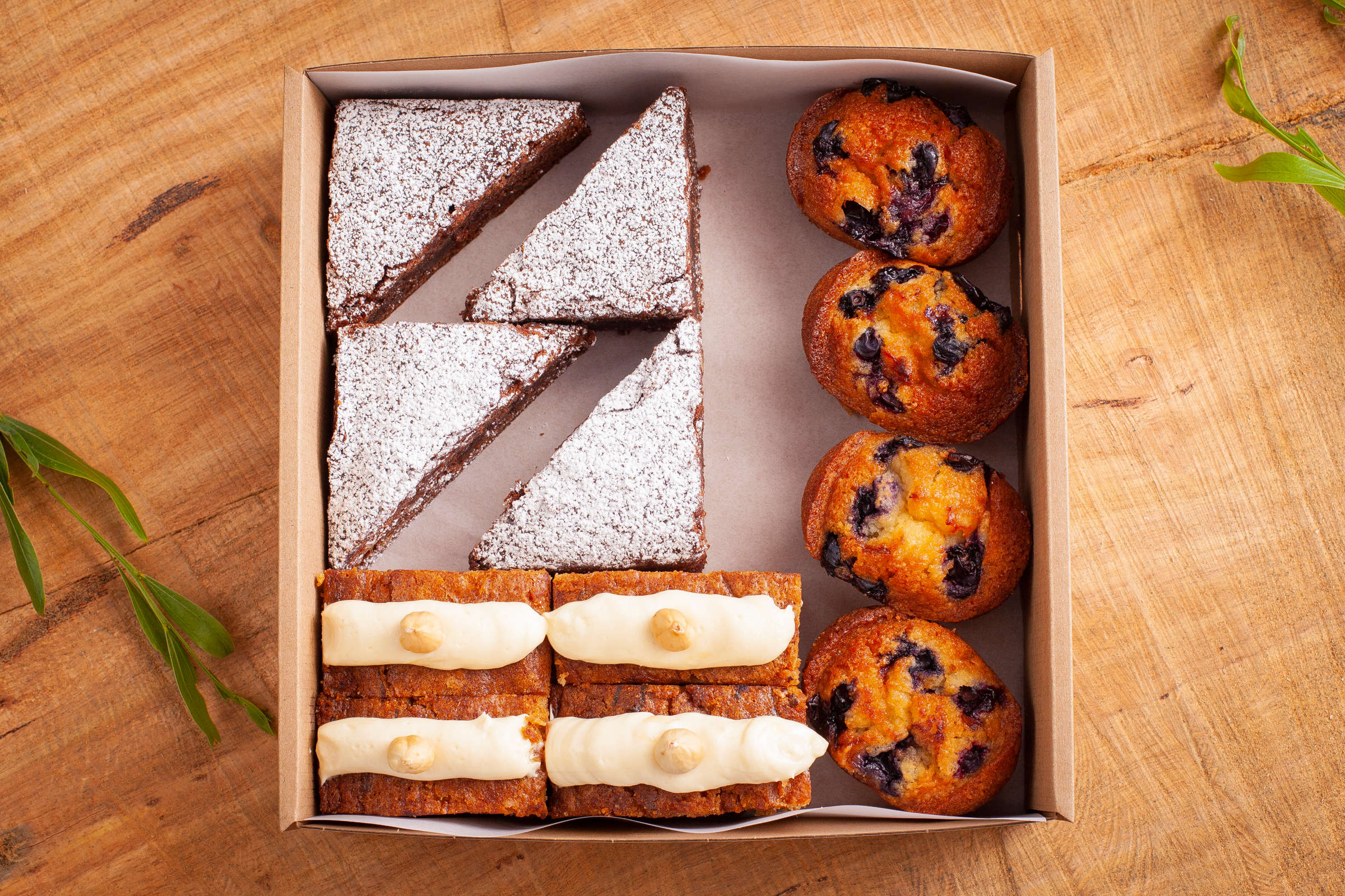 Gluten-free sweet box containing 12 items including chocolate brownie, friands, cake. Credit: Richard Jupe.