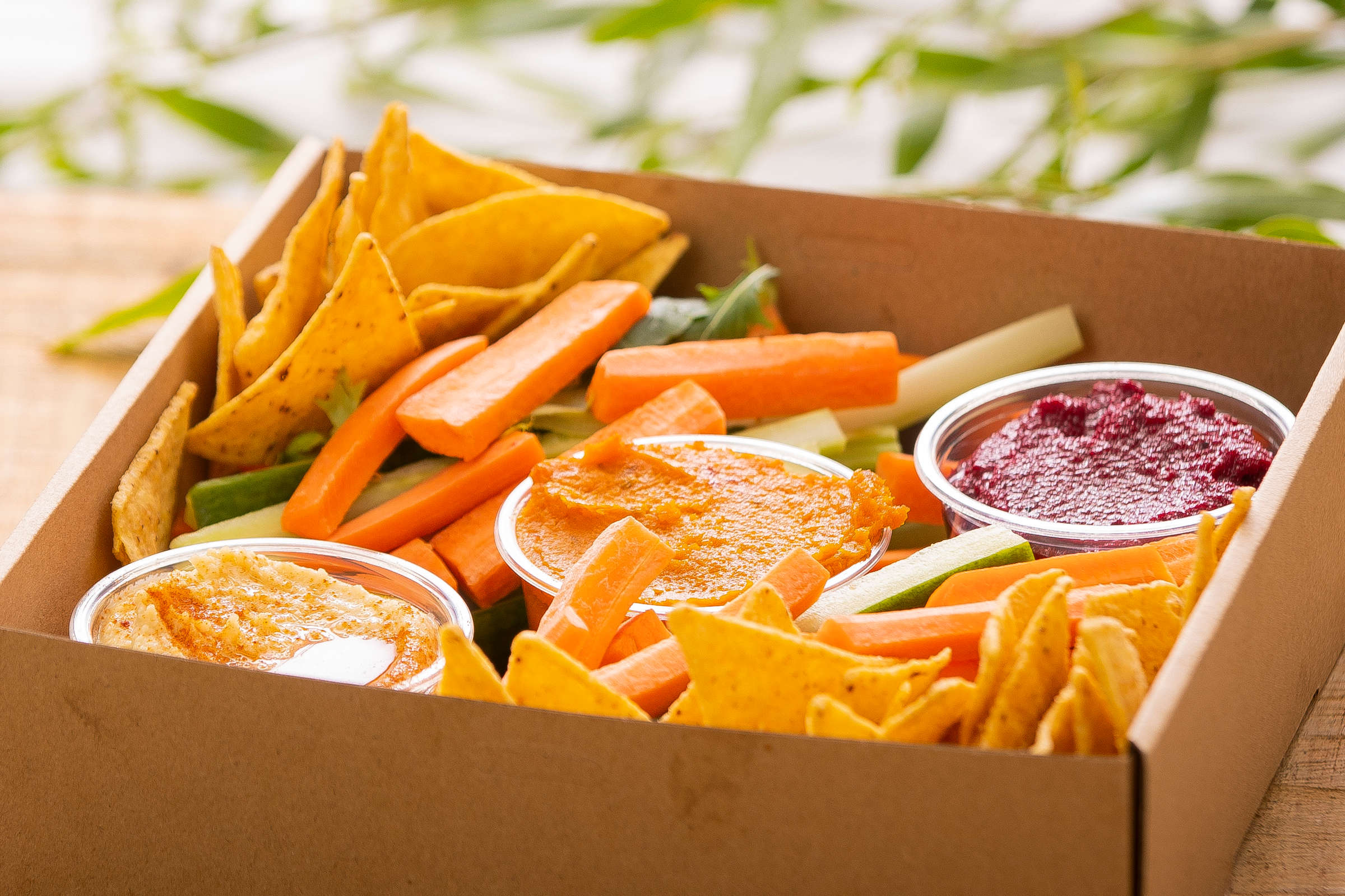 Dip and crudite catering box. Box pictured includes corn chips, carrot sticks, cucumber sticks, hummus, beetroot dip, and pumpkin and feta dips. Credit: Richard Jupe.
