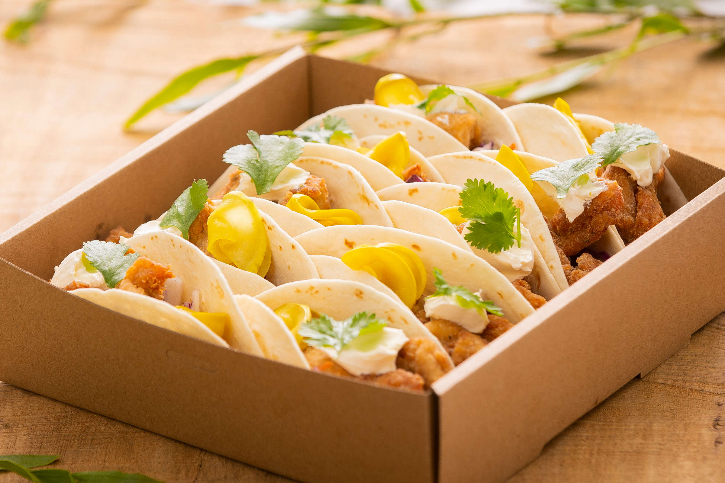 Taco box containing 10 tacos fillings include fried chicken and fried cauliflower. Credit: Richard Jupe.