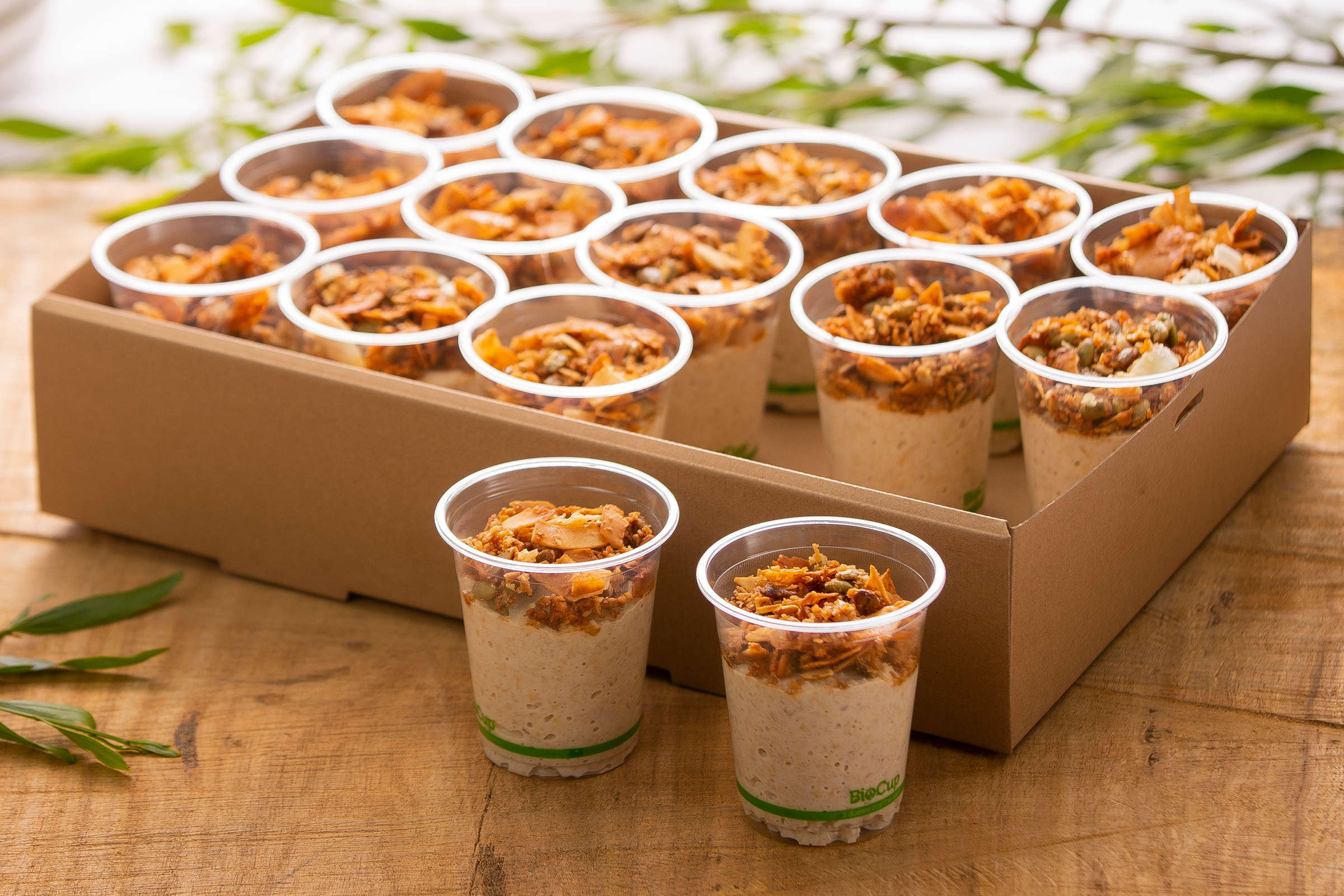 Bircher muesli cups with coconut and seed crunch, and poached seasonal fruit. Credit: Richard Jupe.