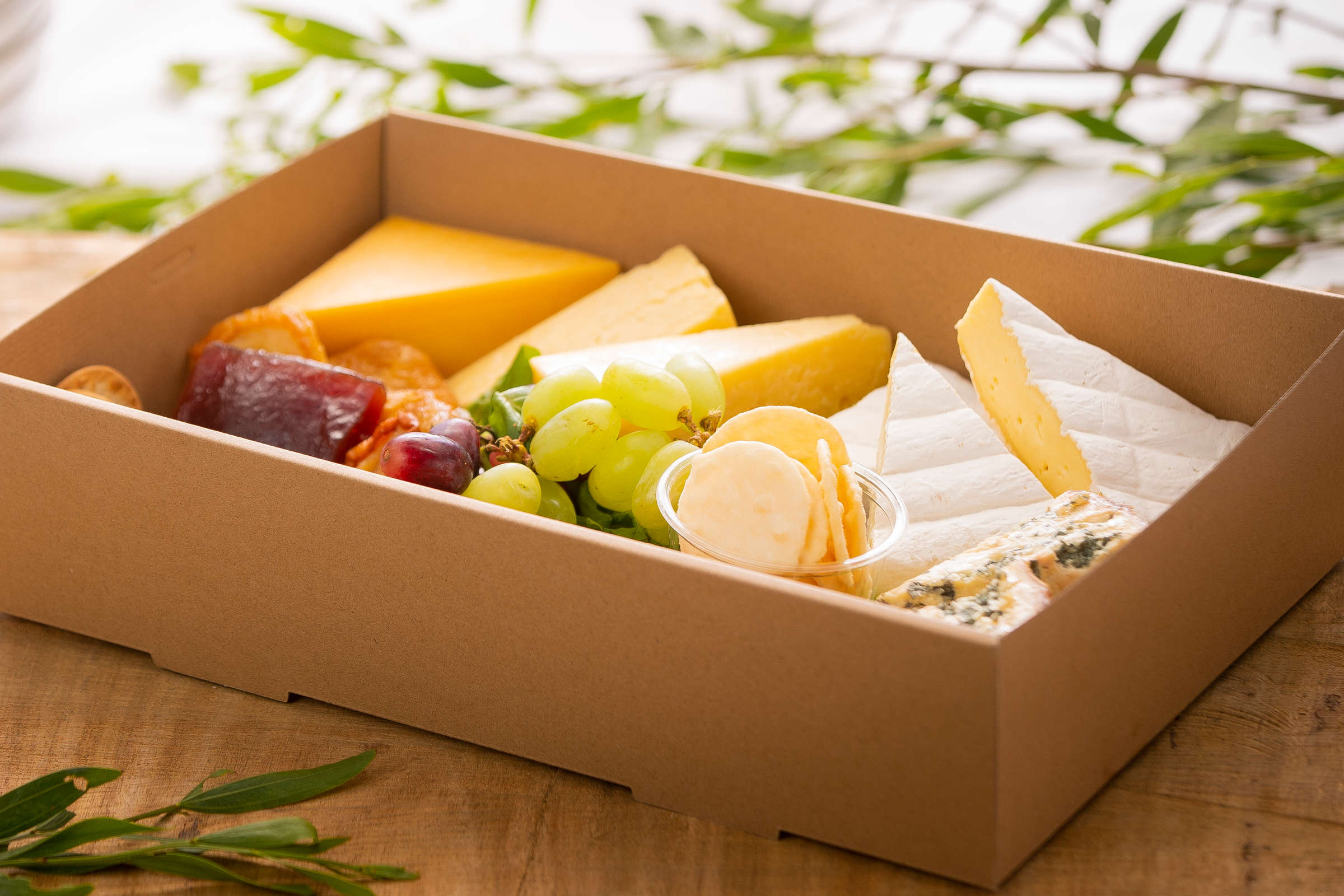 Tasmanian cheese box including brie, Blue and Cheddar with quince paste and crackers. Credit: Richard Jupe.