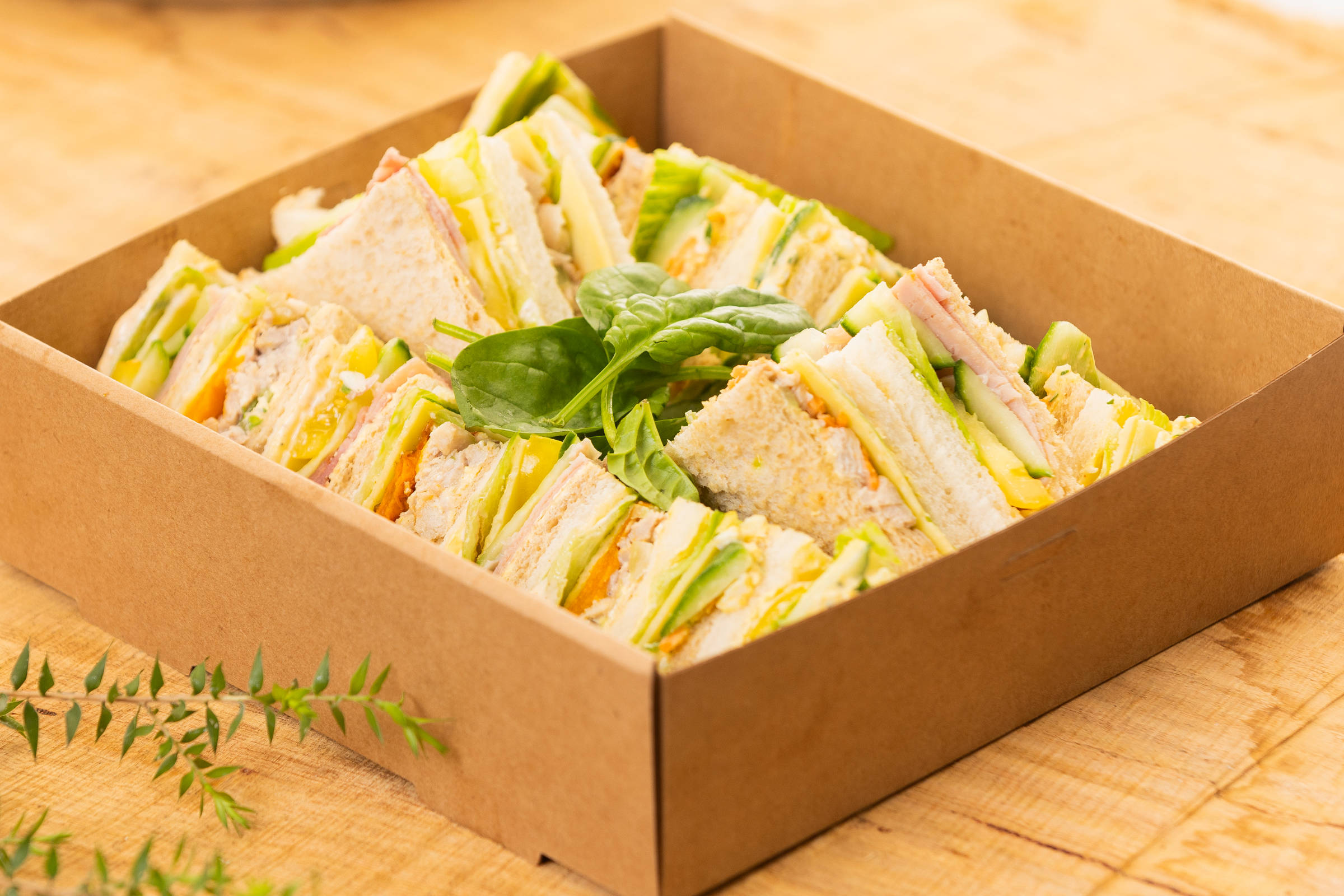 Mixed sandwich catering box containing 20 triangles, fillings include free range ham, vegetarian, free range chicken, egg and cheese all with assorted salad Credit: Richard Jupe.